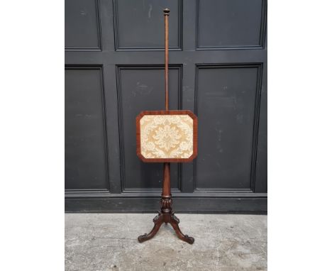 A Victorian mahogany tripod polescreen.&nbsp;&nbsp; 