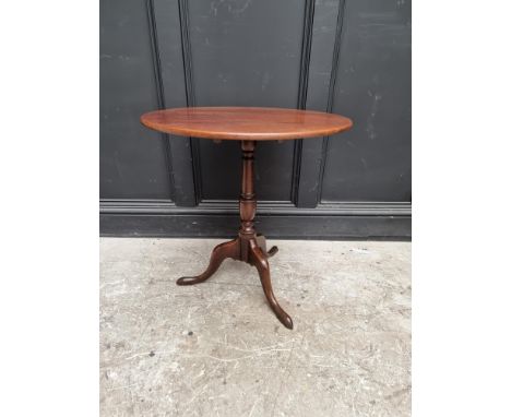 A George III mahogany circular tilt-top tripod table,&nbsp;with one-piece top, 63.5cm diameter. 