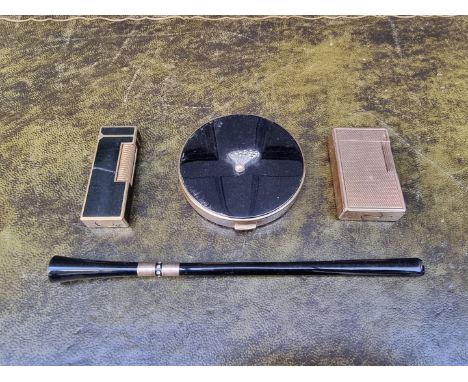 A Dunhill lighter; together with a Dupont engine turned gilt lighter; a vintage compact by Jackel &amp; Co; and a vintage cig