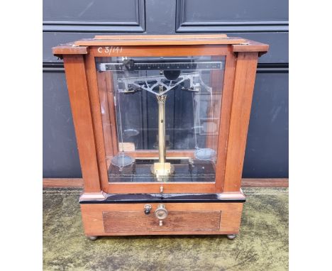 A mahogany cased laboratory balance scale. 