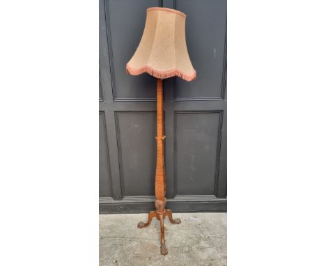 A 1930s walnut tripod standard lamp.&nbsp; 