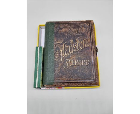 A Victorian Gladstone musical photograph album; together with a Hohner harmonica.&nbsp; 