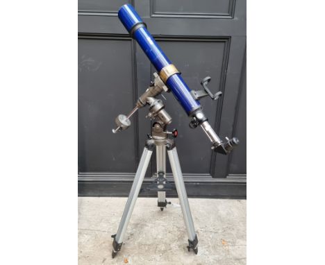 A Skylux telescope, on tripod. 