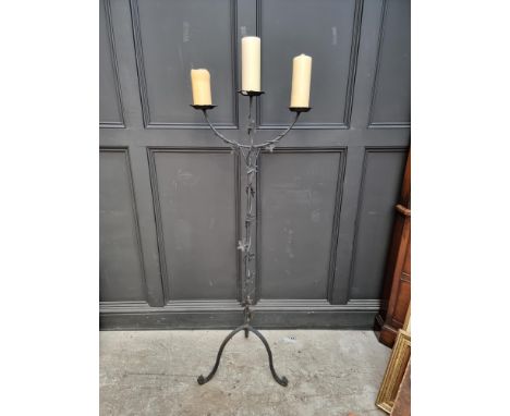 A large wrought iron three branch tripod candlestick,&nbsp;145.5cm high.&nbsp; 