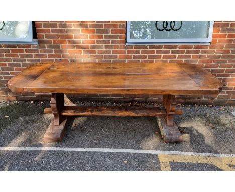 A large oak refectory table, with 7cm thick twin plank cleated end top, 243cm long; together with a set of eight ash and rush