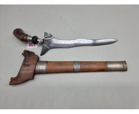 A Malaysian kris and scabbard, with 28cm blade. 