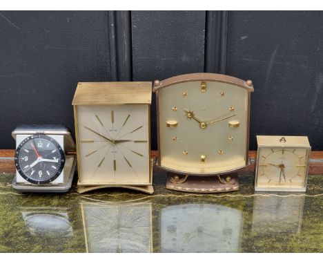 Four vintage clocks and timepieces, to include Smiths examples, largest 15cm high 