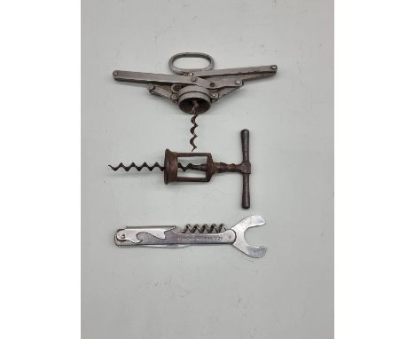 A concertina corkscrew, inscribed 'H.D Armstrong Patent'; together with a waiter's champagne corkscrew; and a half-barrel cor