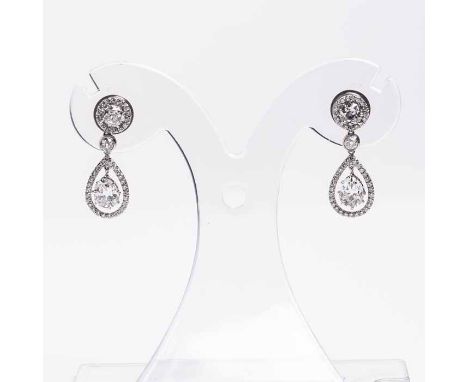 PAIR OF OUTSTANDING DIAMOND DROP EARRINGS
each set with a pear cut diamond of approximately 1.0 carats, suspended in a surrou