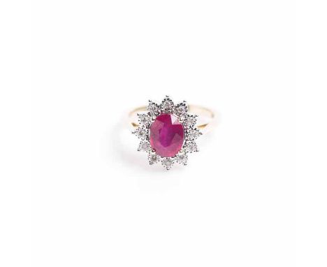 RUBY AND DIAMOND CLUSTER RING
the oval cut ruby approximately 2.20 carats, surrounded by illusion set diamonds, in nine carat