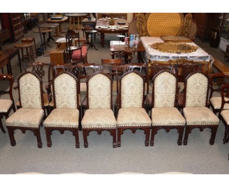 A set of six Gothic design dining chairs, having floral tapestry upholstered seats and backs&nbsp;