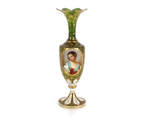 A 19th Century green overlaid glass baluster vase, decorated foliate and portrait panels richly heightened in gilt, 36cm high