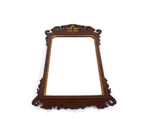 A 19th Century mahogany Chippendale style wall mirror, having fret carved frame with pierced gilt floral decoration to the pe