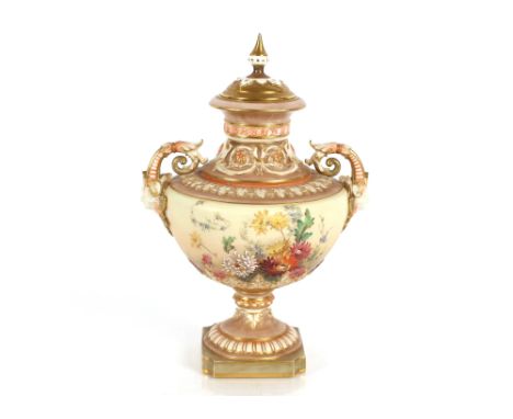 An Edwardian Royal Worcester baluster vase and cover, richly decorated with foliate sprays heightened in gilt flanked by mask