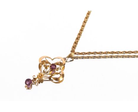 A 9ct gold and amethyst floral pendant hung to a fine 9ct gold chain, 7.5gms total weight&nbsp;