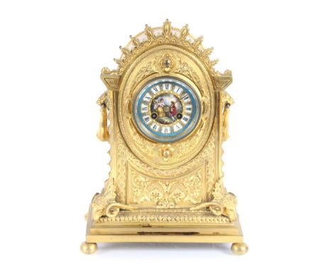 A 19th Century French Ormolu mantel clock, having foliate and rams head decoration, the circular Sevres style Roman numeral d