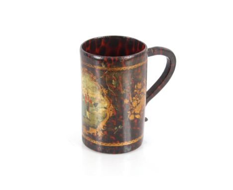 A decorative papier m&acirc;ch&eacute; tankard, with faux tortoiseshell finish, central cartouche decorated with figures in a