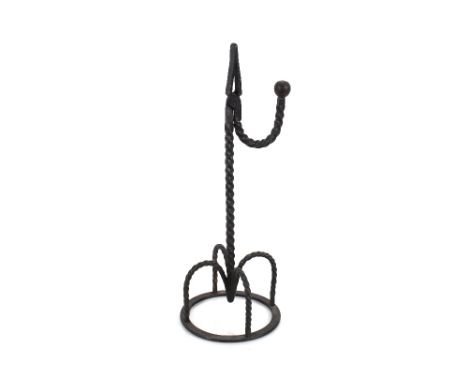 An Irish wrought iron "crown" base rush light holder, 41cm high overall