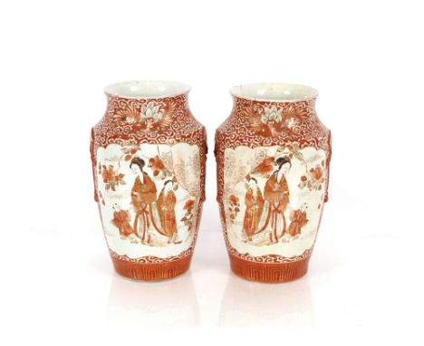 A pair of Japanese Kutani type baluster vases, decorated with figures in a garden setting, 28cm high; a pair of Satsuma balus