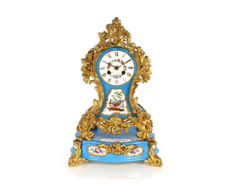 A Sevres style pale blue porcelain mantel clock on plinth, decorated foliate and bird panels with applied gilded vine leaf de