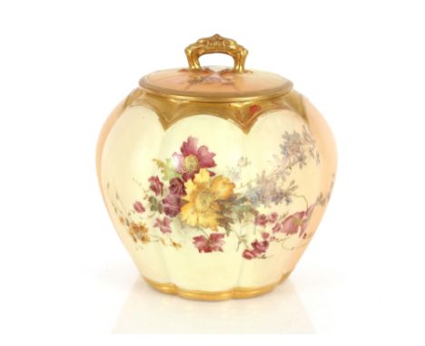 A Royal Worcester jar and cover of pumpkin shape, having foliate spray decoration on a blush ivory ground heightened in gilt,