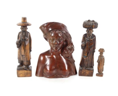 A carved hardwood Bali head, inscribed to base "A. Fatimah, Bali", 10cm high; a pair of Chinese carved wooden figures, 28cm h