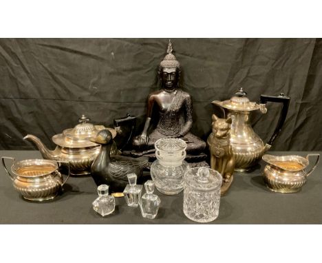 An EPNS boat shaped stop fluted four piece tea service; a bronzed resin model of Buddha, 35cm; three clear glass faceted scen