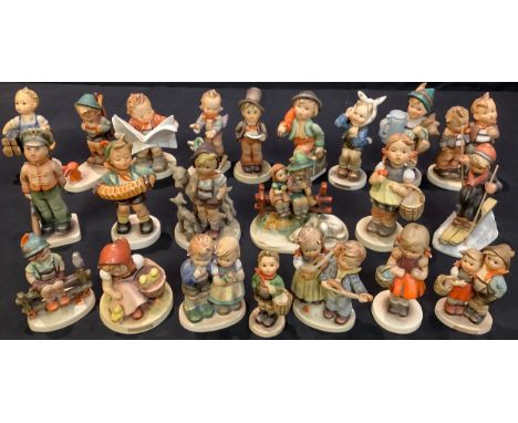 A collection of Goebel Hummel figures including Latest News, Sister, For Father, Little Goat Herder, Eventide, Soldier Boy, S