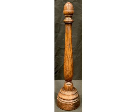 An early 20th century oak wig stand, turned column with acorn knop finial, stepped circular base, 46cm 
