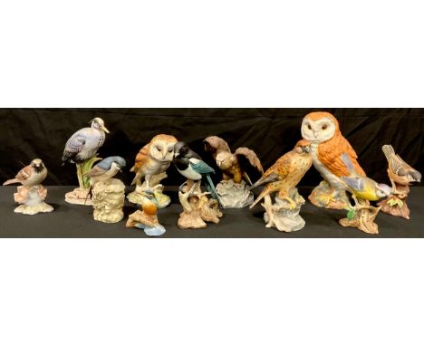 A Beswick model of a Barn Owl, number 1046, 19cm; other continental porcelain bird models, owl, eagle, kingfisher, magpie, et