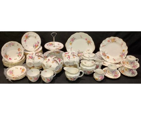 A Royal Crown Derby Posies pattern tea service for twelve comprising bachelor's teapot, cream jugs, sugar bowls, sucrier, two