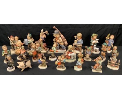 A collection of Goebel Hummel figures including The Cellist, Favorite Pet, Happy Traveler, Shepherd's Boy, A Fair Measure, Fo