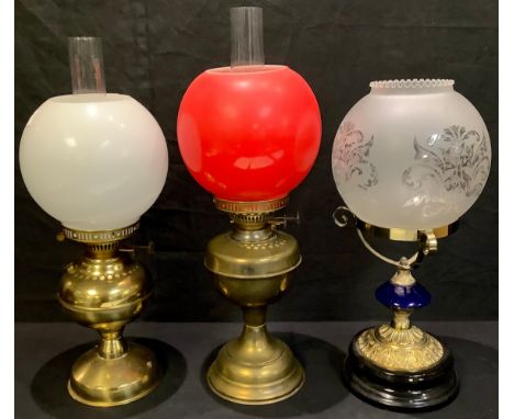A brass Duplex oil lamp; another; an oil lamp base and shade (3) 