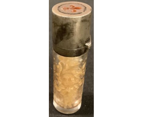 A French silver and enamel mounted scent bottle, cut in the Rococo taste with diapers and leafy scrolls, hinged cover decorat