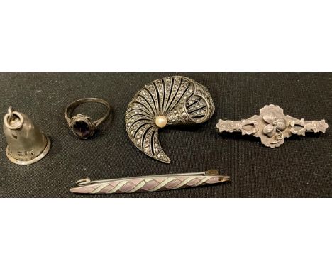 A silver marcasite scroll brooch, set with a single pearl, marked 925; a silver shamrock brooch; a silver bell shaped cigar p