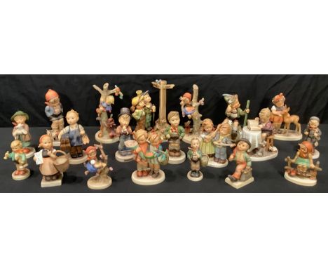 A collection of Goebel Hummel figures including Little Bookkeeper, Farm Boy, Friends, Boots, Out Of Danger, Crossroads, Going