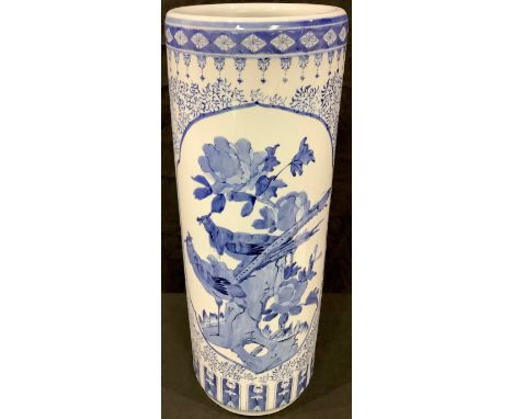 A Chinese export ware blue and white cylindrical stick stand, printed and painted with birds perched amongst blossom, 63cm, 2