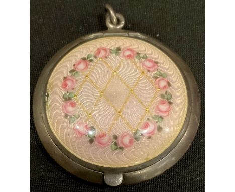 A continental silver lady's circular powder box and cover, pink engine turned enamel cover with gilt lattice design, 5.5cm ov