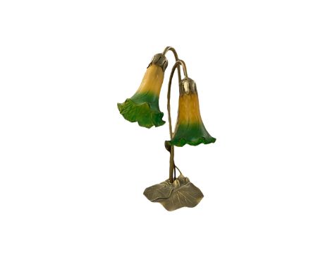Art Nouveau inspired Tiffany style table lamp, with decorative lily pad base, and two amber and green tulip design glass shad