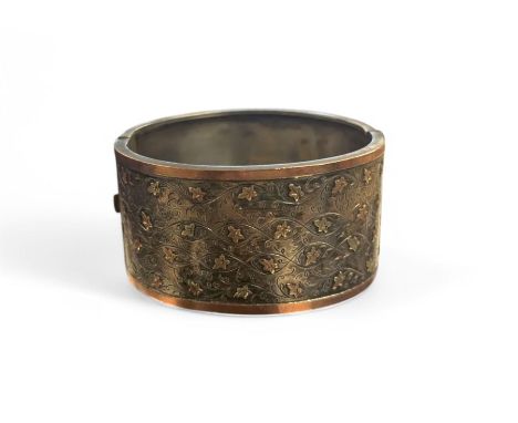 Victorian silver bangle with gold overlay leaf design Condition Report:Approx 41 grams, unmarked tests silver