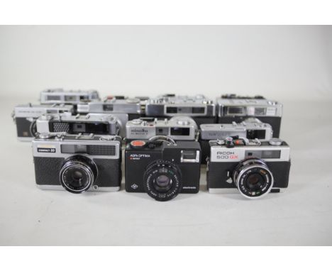 14 vintage film cameras to include Ricoh 500 GX and others.  Some of the shutters work but some do not and some require bits 