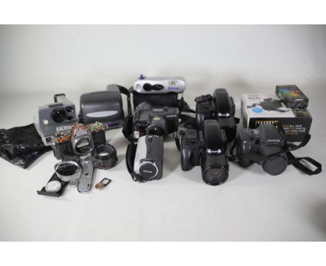 Job Lot Video Cameras and a Camera Lens plus some polaroid style cameras