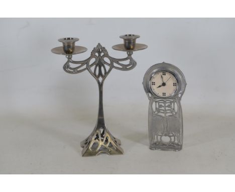 Art Nouveau-Style Plated Candleabra and Sheffield Pewter Clock by Charles Rennie An Art Nouveau-style plated candleabra is ac