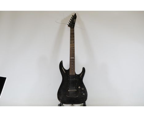 LTD MH-100QMNT Electric Guitar, Serial Number L12073557This item is an LTD MH-100QMNT electric guitar, featuring a model numb