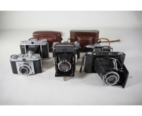 8 vintage folding cameras various zeiss ikon makes.  All of these cameras are being sold as untested. Camera list as follows 