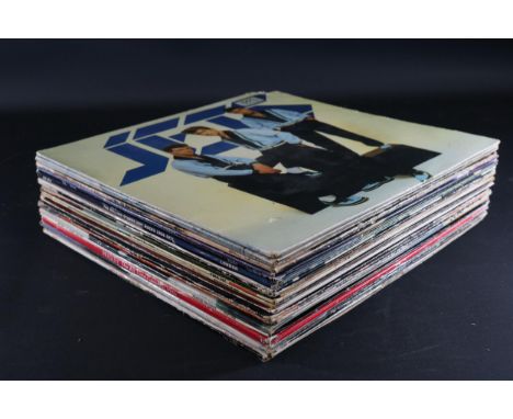 Collection of 24 12" vinyls featuring Led Zeppelin, Michael Jackson, David Bowie, Beach Boys, and others. Good condition with