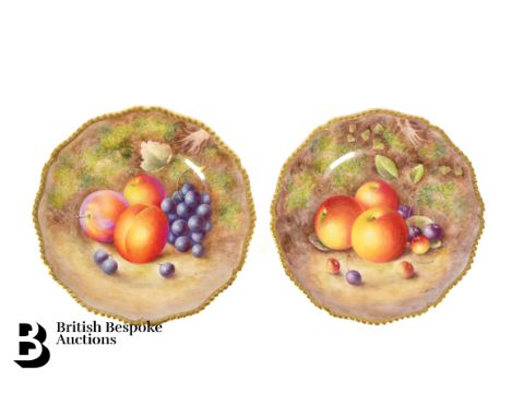 A pair of Royal Worcester Fallen Fruits cabinet plates. Each plate painted with autumnal fruits heightened with gilt rims, si