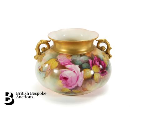 Royal Worcester twin-handled vase. The vase decorated with roses, heightened with gilt to the collar and handles, signed Will