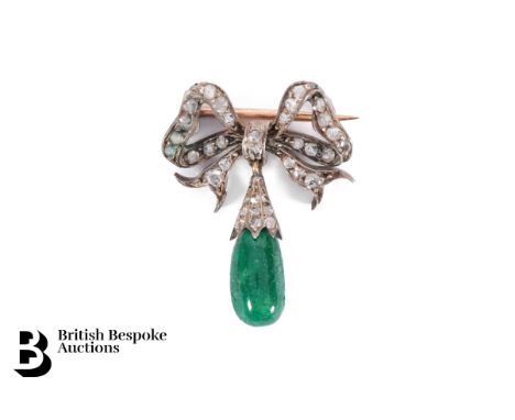 Late Victorian 14/15ct yellow and white gold, diamond and emerald brooch, in the form of a bow with a tear shaped emerald dro