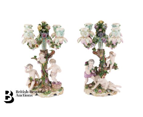 Continental porcelain four branch candelabra. The figurative stems modelled as a floral encrusted tree trunk surrounded by th